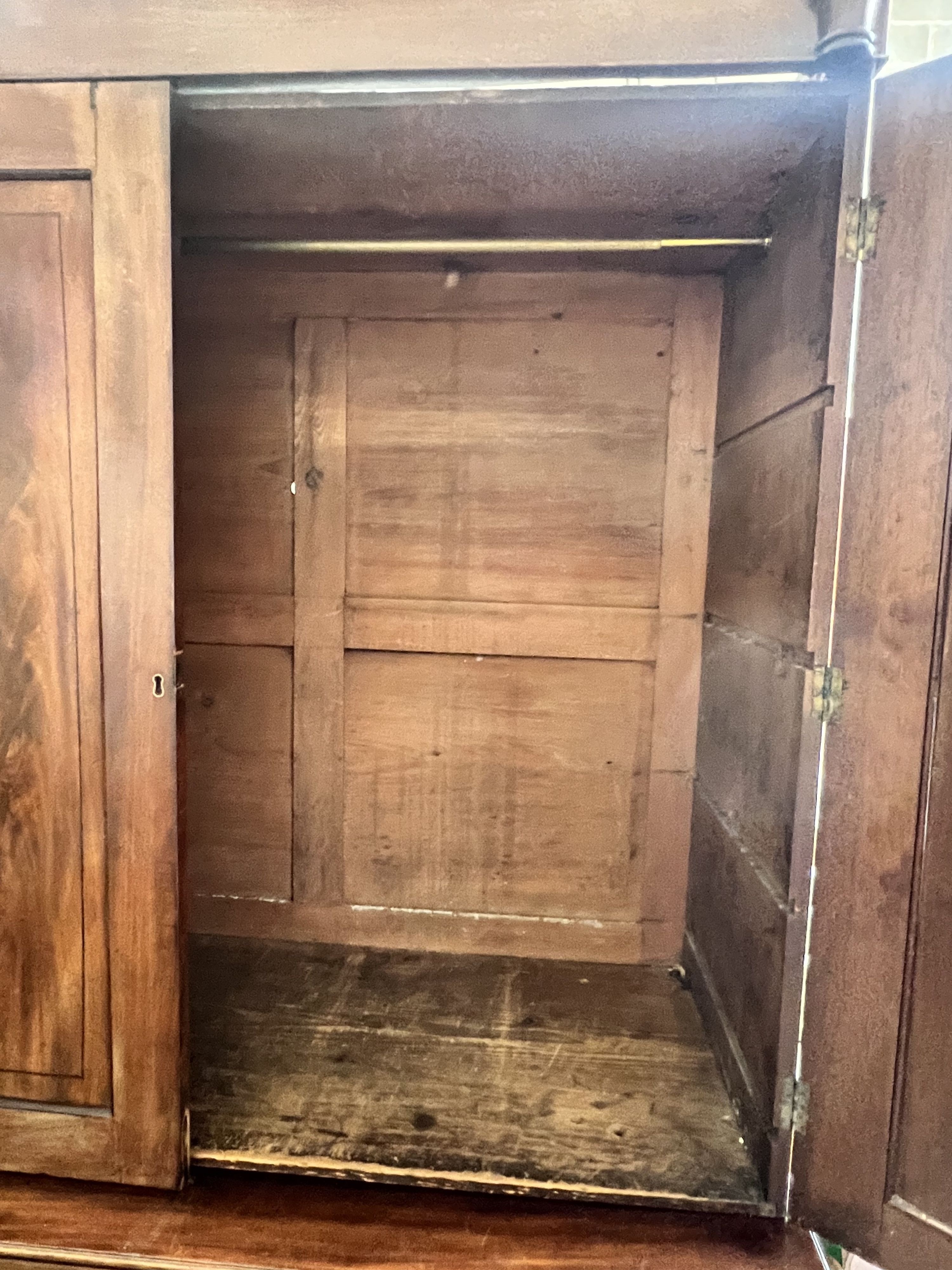 A Regency mahogany linen press, converted to a hanging wardrobe, width 122cm depth 55cm height 216cm